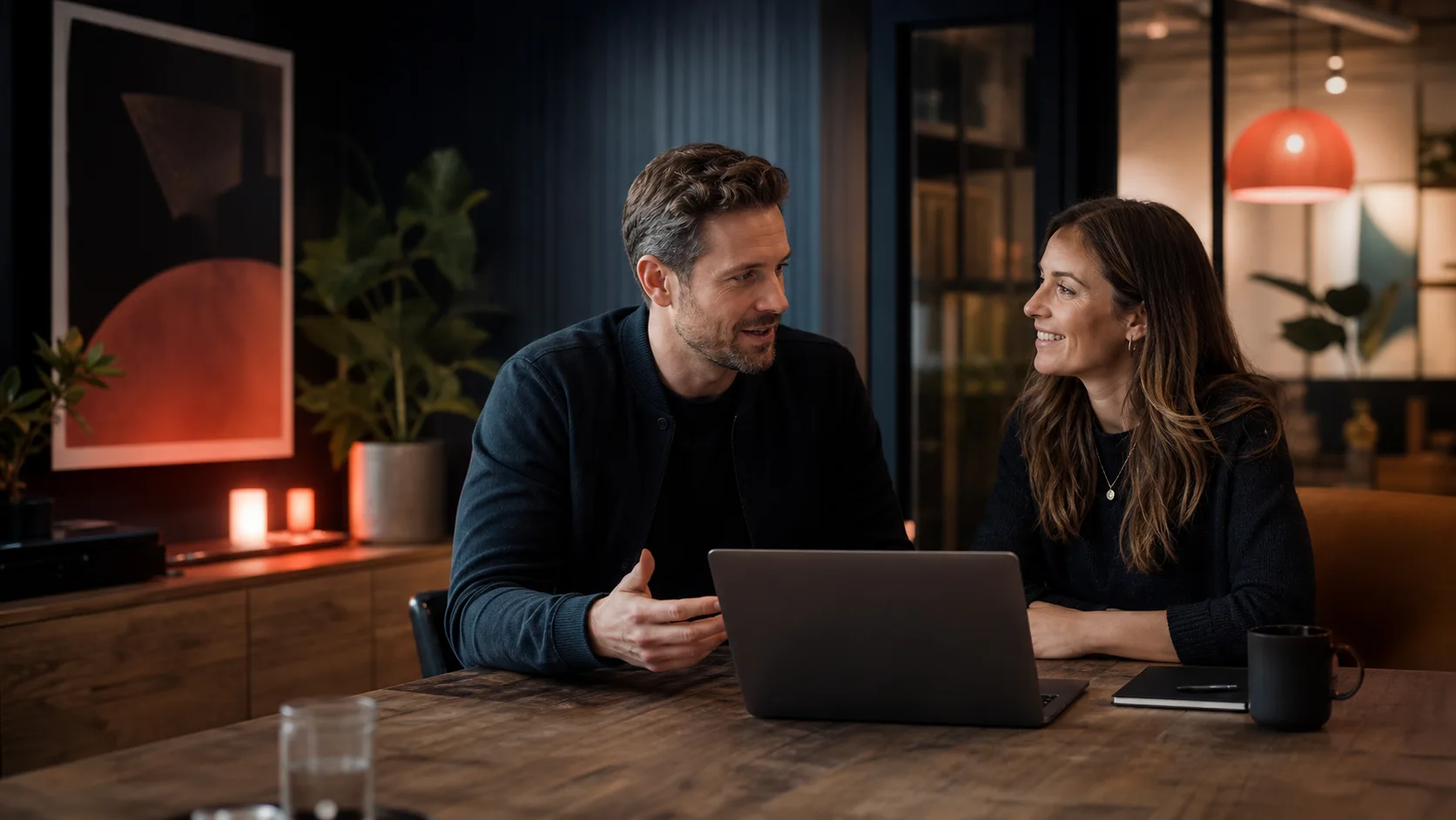 A founder and digital product designer discussing a project together.
